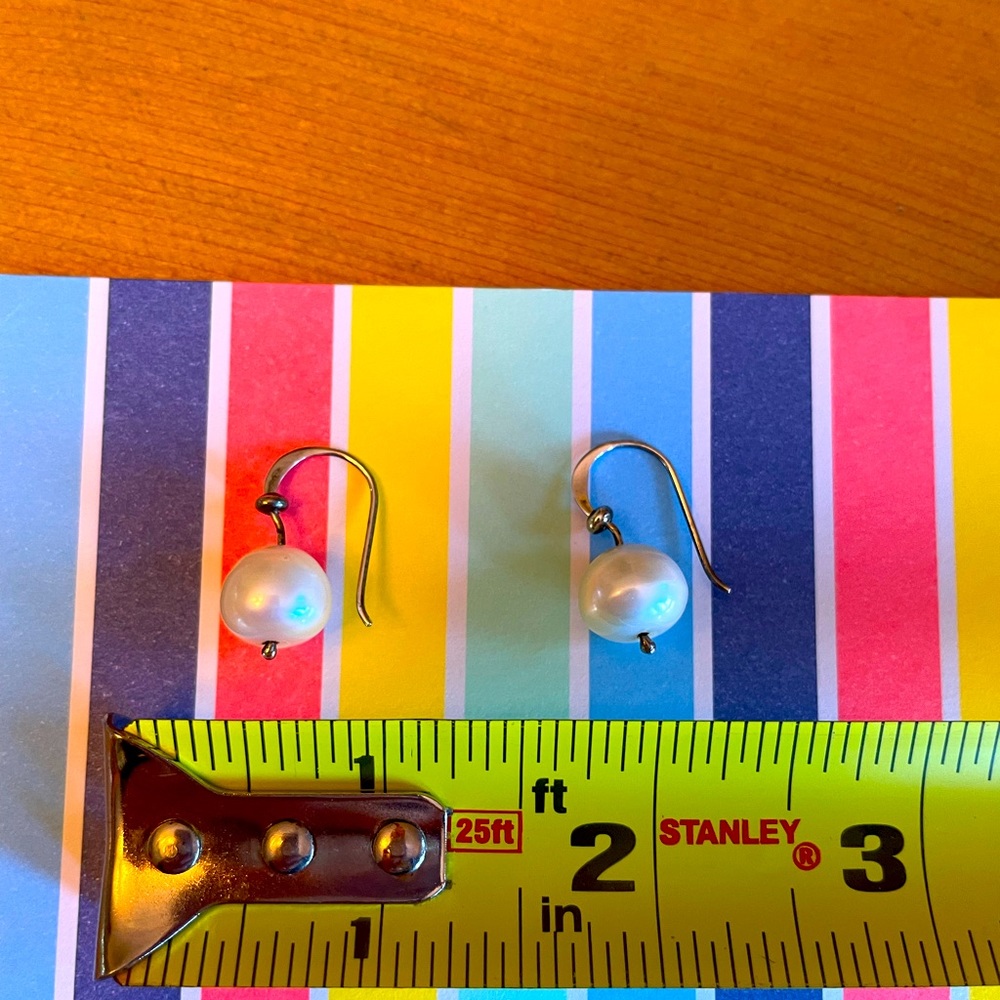 Pearl and handcrafted sterling silver earrings.